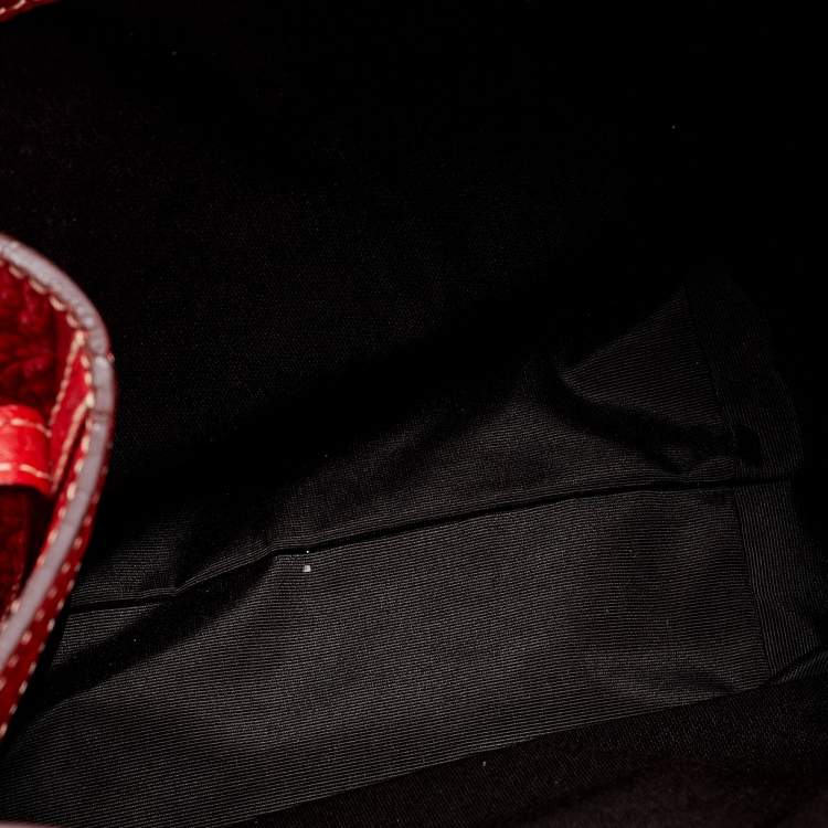 Pre Owned CH Carolina Herrera Red Monogram Embossed Leather Bucket Bag
