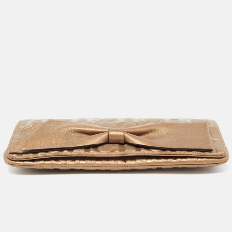 Pre Owned CH Carolina Herrera Gold Monogram Leather Bow Chain Clutch