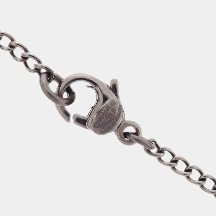 Pre Owned Chanel CC Crossbones Pendant Necklace Silver Black