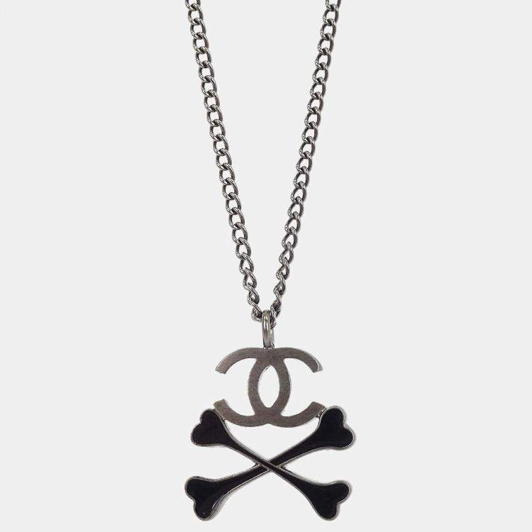 Pre Owned Chanel CC Crossbones Pendant Necklace Silver Black