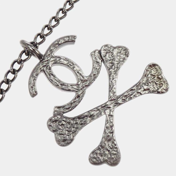 Pre Owned Chanel CC Crossbones Pendant Necklace Silver Black