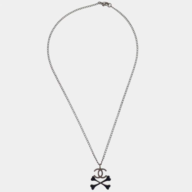 Pre Owned Chanel CC Crossbones Pendant Necklace Silver Black