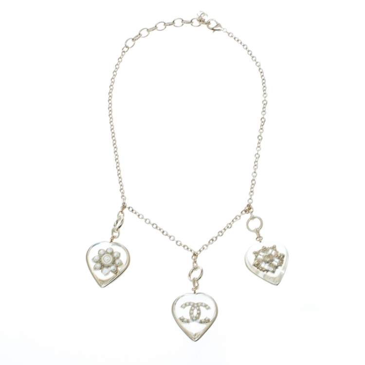 Chanel CC Aged Gold Tone Metal Motif Embedded Resin Heart Pendants Necklace  Chanel | The Luxury Closet