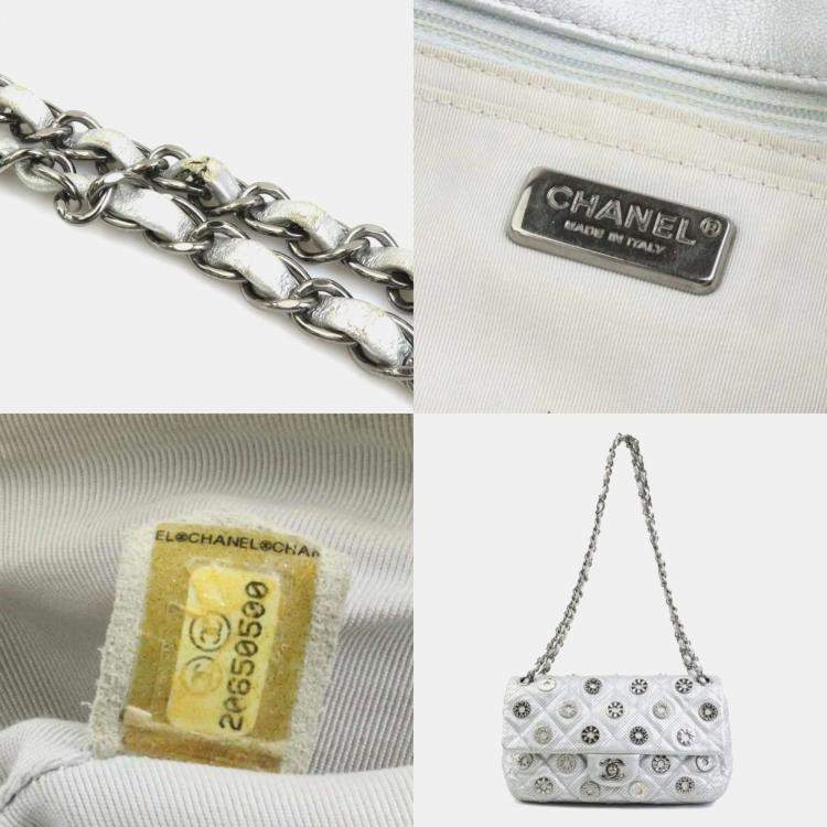 Pre Owned Chanel Silver Leather and Metal Rhinestone Paris-Dubai Perforated Eyelet Shoulder Bag