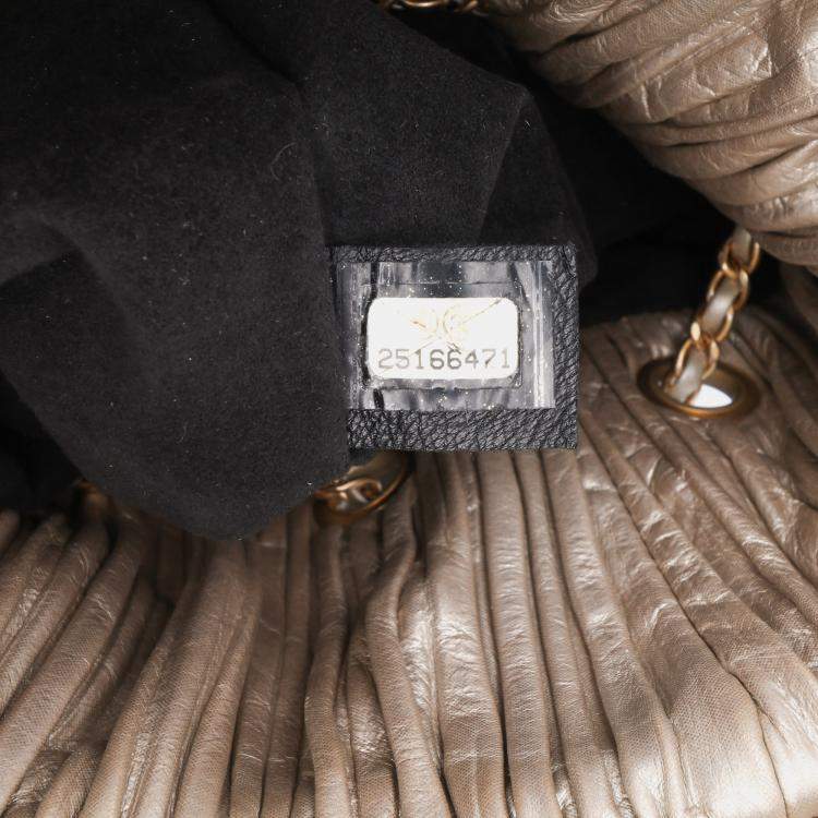 Pre Owned Chanel Medium Metallic Calfskin Coco Pleats Drawstring Backpack