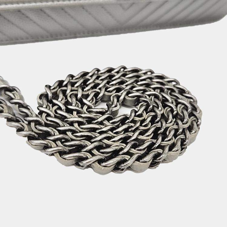 Pre Owned Chanel Silver Leather Caviar Chevron WOC Mini Crossbody Bag