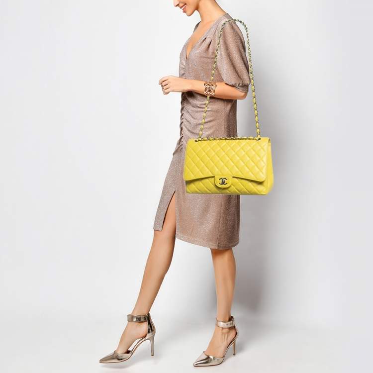 Pre Owned Chanel Yellow Quilted Caviar Leather Maxi Classic Single Flap Bag