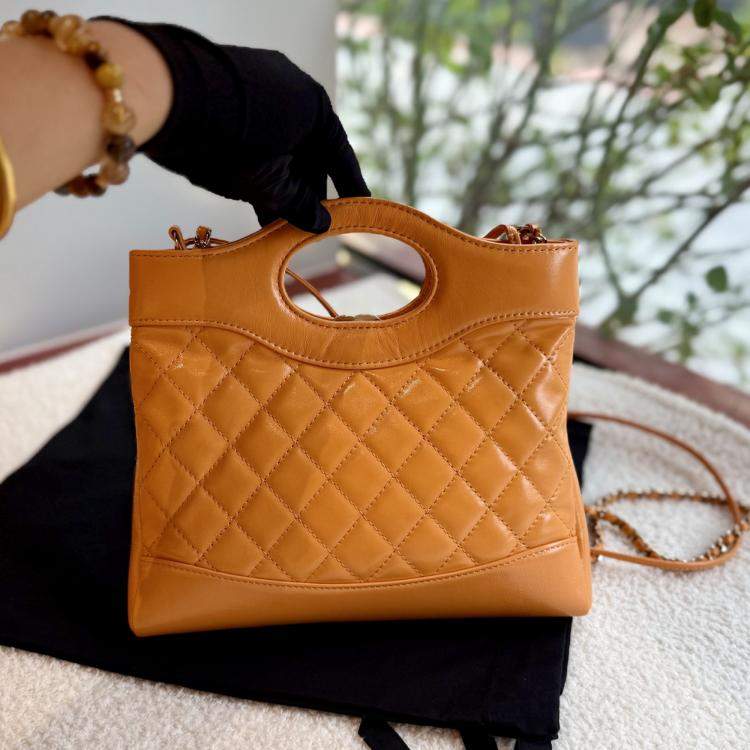Pre Owned Chanel 31 Orange Quilted Leather Handbag