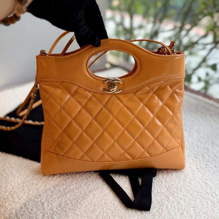 Pre Owned Chanel 31 Orange Quilted Leather Handbag