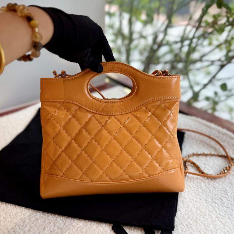 Pre Owned Chanel 31 Orange Quilted Leather Handbag