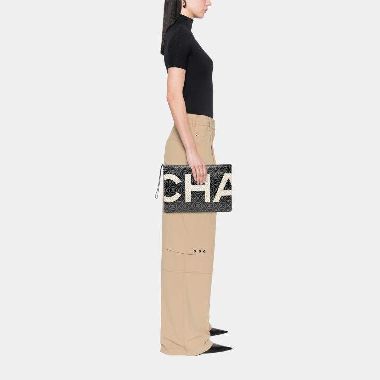 Pre Owned Chanel Black White Coated Canvas Camellia Logo Wristlet Clutch