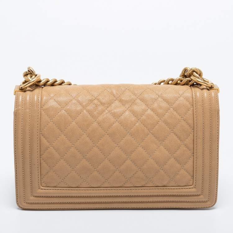 Pre Owned Chanel Beige Quilted Caviar Leather Medium Boy Flap Bag