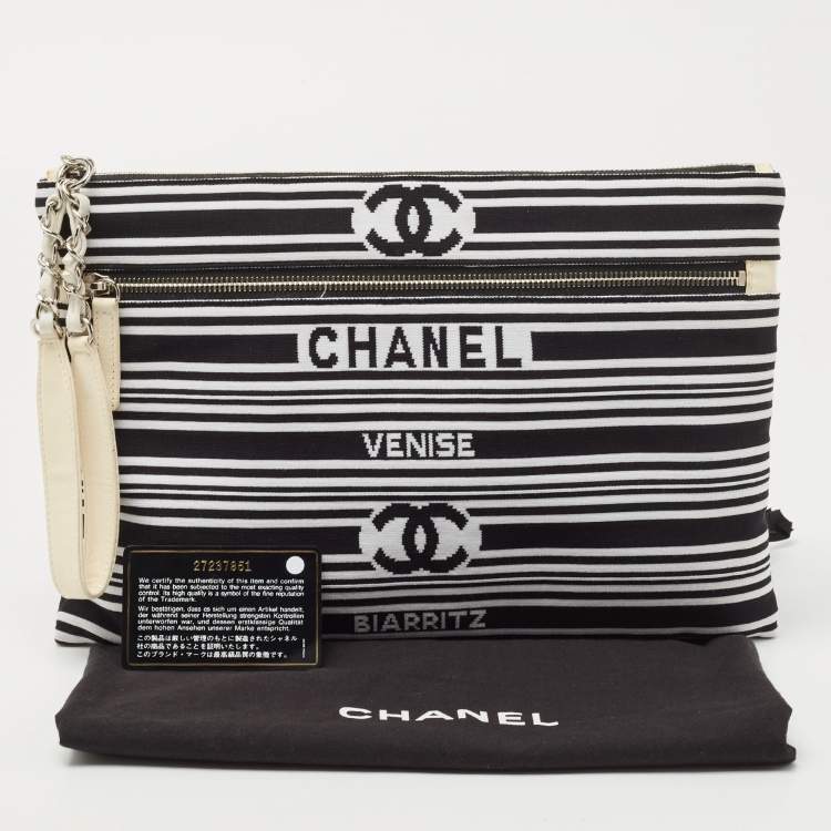 Pre Owned Chanel Black/White Stripe Fabric and Leather Zip Wristlet Clutch