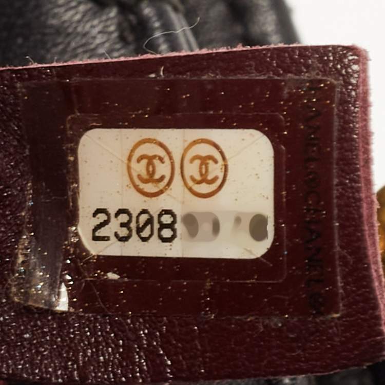 Pre Owned Chanel Black Quilted Leather Gold Bar Top Handle Bag