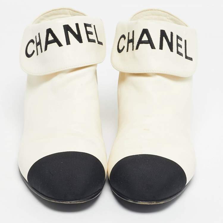 Pre Owned Chanel Ivory/Black Leather Logo Cap Toe Ankle Length Boots Size 38.5