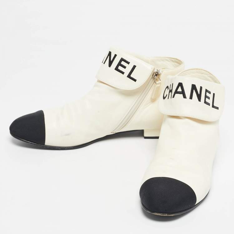 Pre Owned Chanel Ivory/Black Leather Logo Cap Toe Ankle Length Boots Size 38.5
