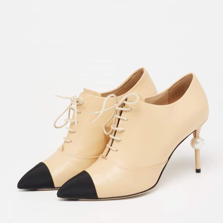 chanel lace up boots beige