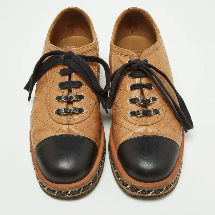 Pre Owned Chanel Tan/Black Quilted Leather Chain Embellished Cap Toe Oxfords Size 36.5