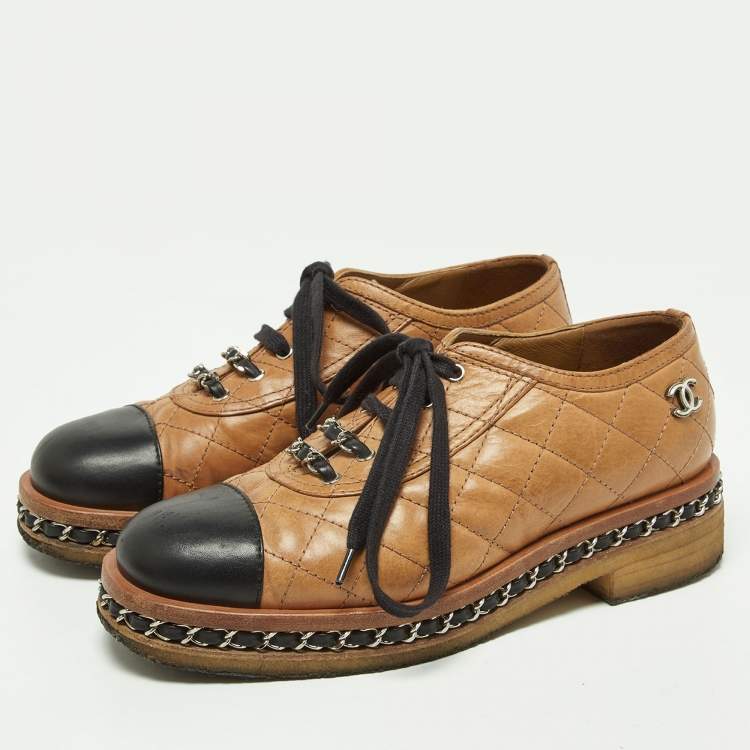 Pre Owned Chanel Tan/Black Quilted Leather Chain Embellished Cap Toe Oxfords Size 36.5