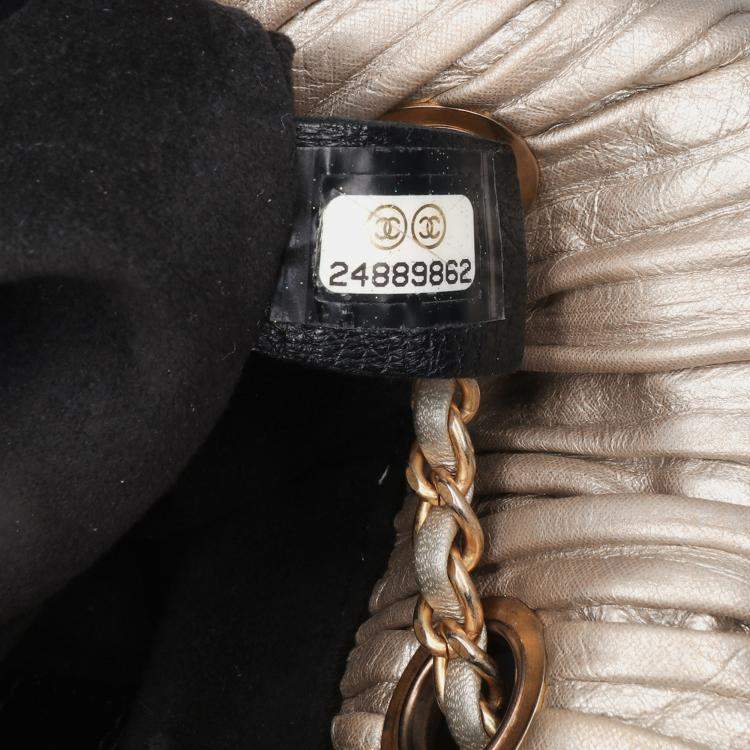 Pre Owned Chanel Gold Small Metallic Calfskin Coco Pleats Drawstring Backpack