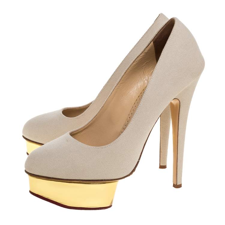 مملوكة مسبقًا Charlotte Olympia Beige Canvas Dolly Platform Pumps Size 39