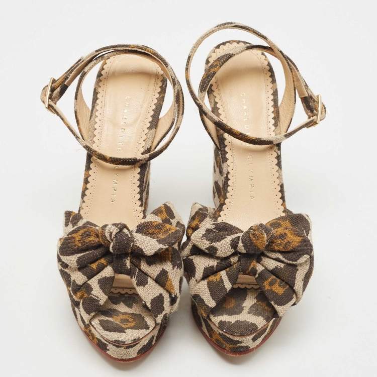 Pre Owned Charlotte Olympia Beige/Brown Leopard Canvas Bow Platform Ankle Strap Wedge Sandals Size 38.5