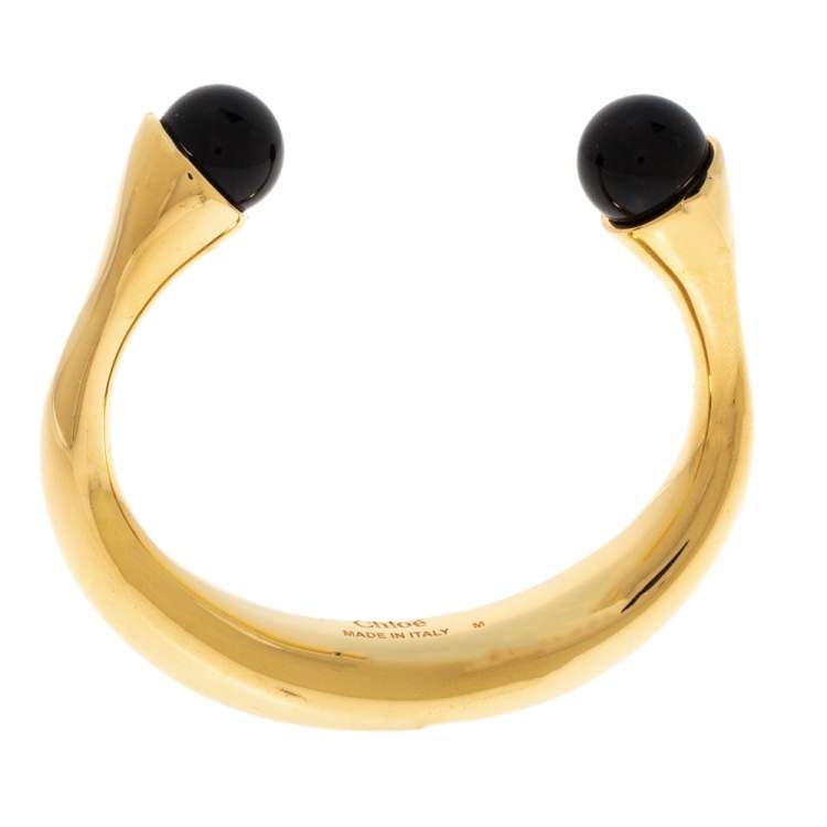 Pre Owned Chloe Darcey Black Bead Gold Tone Open Cuff Bracelet M