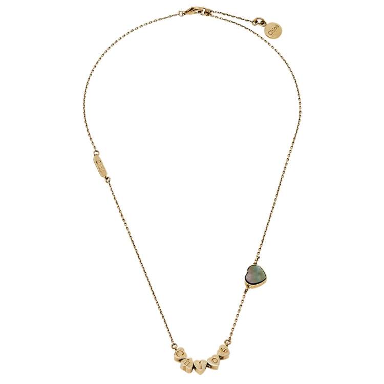 مملوكة مسبقًا Chloé Gold Tone Logo Charms Mother of Pearl Heart Necklace 