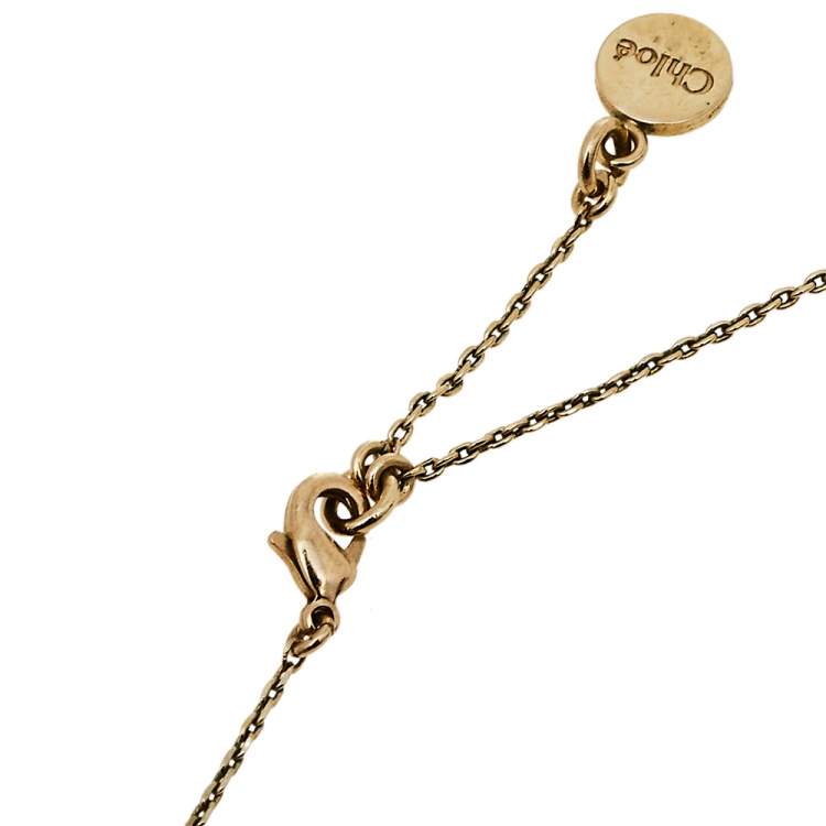 مملوكة مسبقًا Chloé Gold Tone Logo Charms Mother of Pearl Heart Necklace 