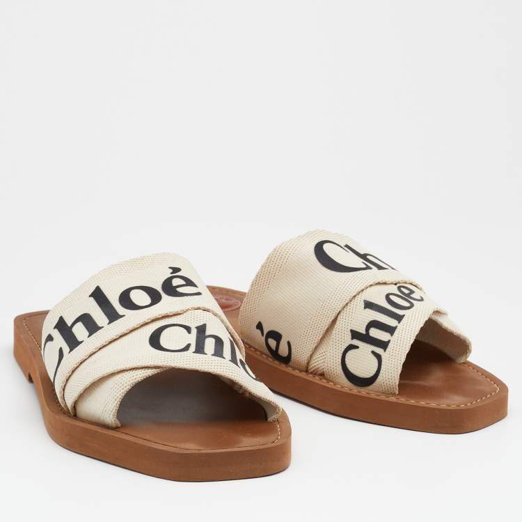 مملوكة مسبقًا Chloé Off White Canvas Logo Ribbon Woody Flat Sandals Size 36