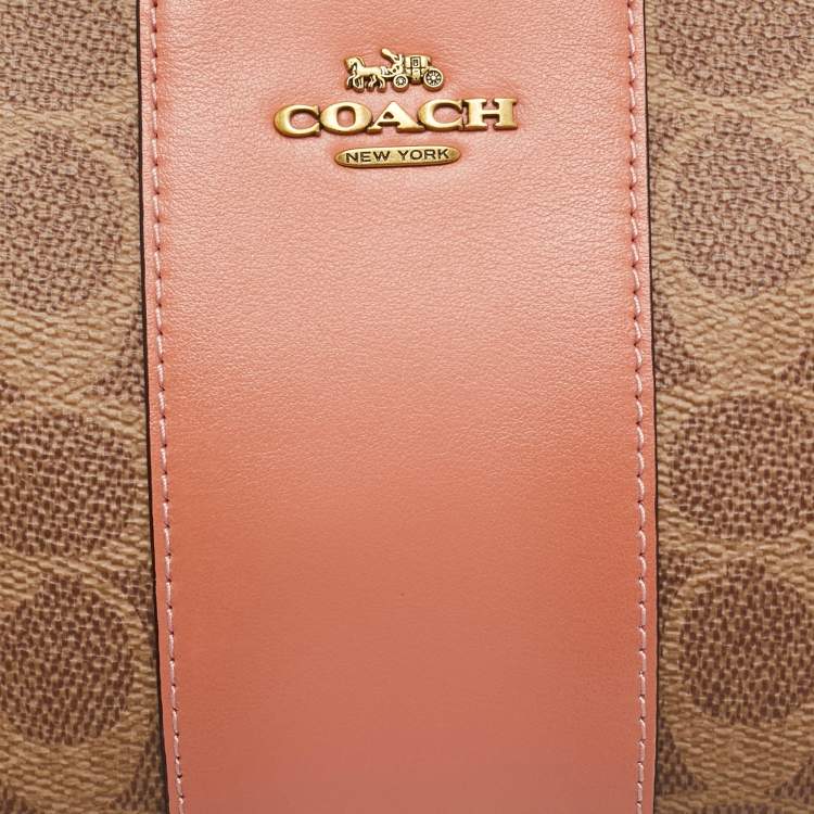 Pre Owned Coach Beige/Peach Signature Coated Canvas and Leather Zip Wristlet Pouch