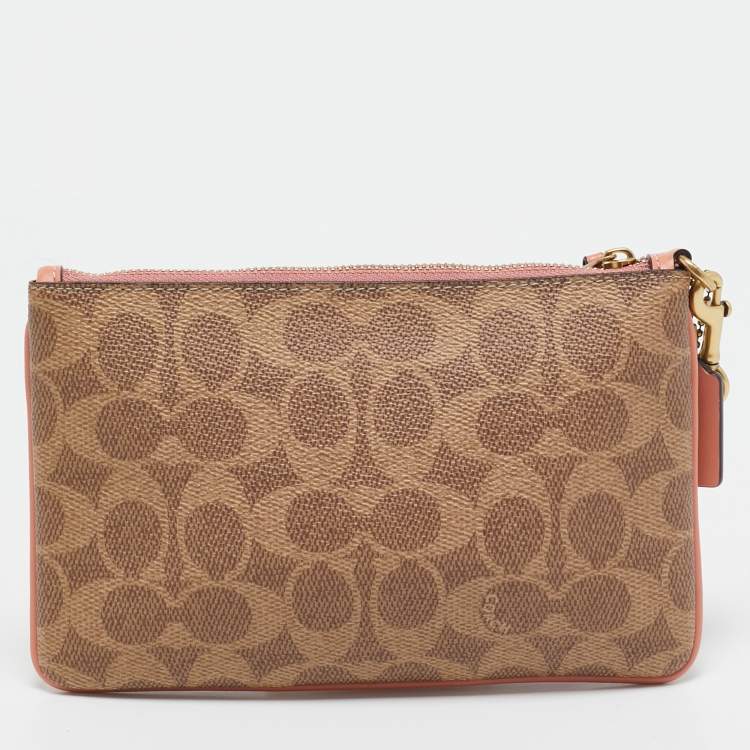 Pre Owned Coach Beige/Peach Signature Coated Canvas and Leather Zip Wristlet Pouch