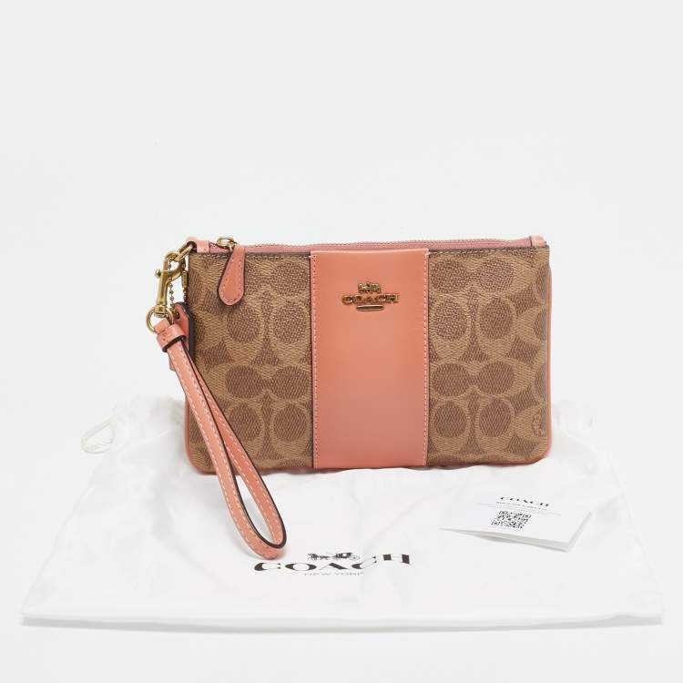 Pre Owned Coach Beige/Peach Signature Coated Canvas and Leather Zip Wristlet Pouch
