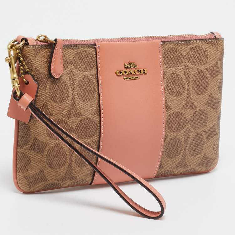Pre Owned Coach Beige/Peach Signature Coated Canvas and Leather Zip Wristlet Pouch