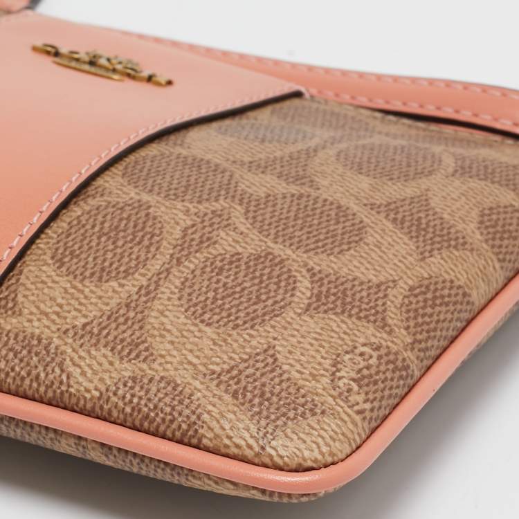 Pre Owned Coach Beige/Peach Signature Coated Canvas and Leather Zip Wristlet Pouch