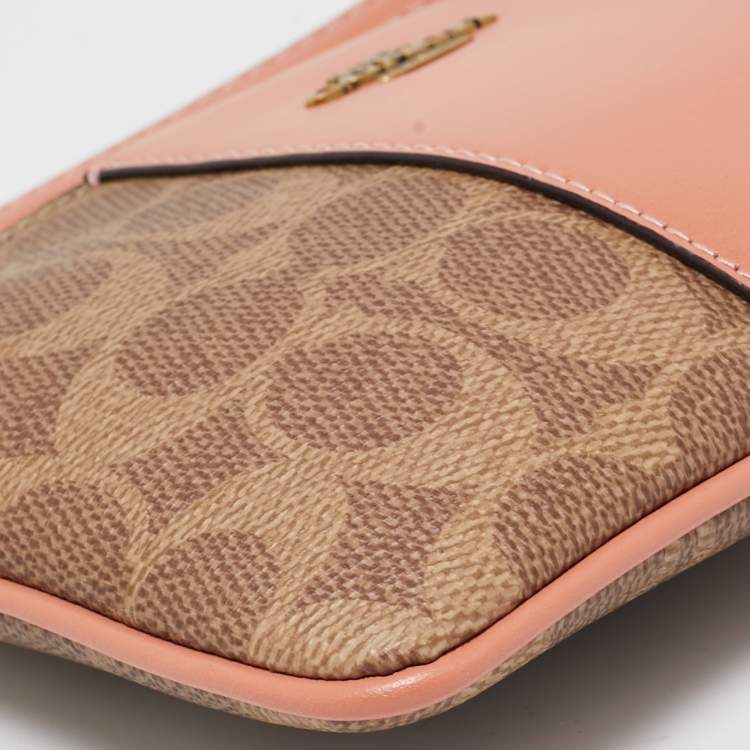Pre Owned Coach Beige/Peach Signature Coated Canvas and Leather Zip Wristlet Pouch