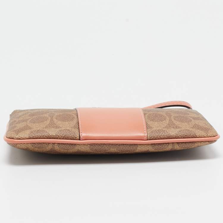 Pre Owned Coach Beige/Peach Signature Coated Canvas and Leather Zip Wristlet Pouch