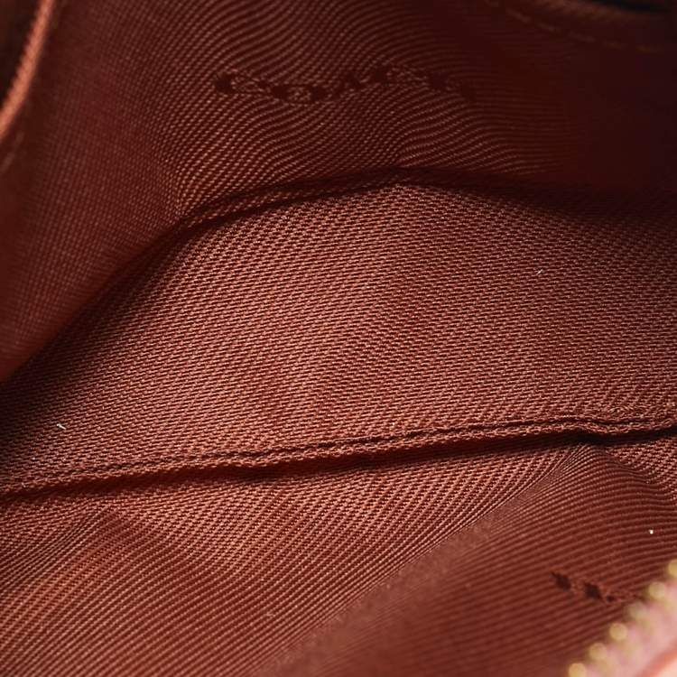 Pre Owned Coach Beige/Peach Signature Coated Canvas and Leather Zip Wristlet Pouch