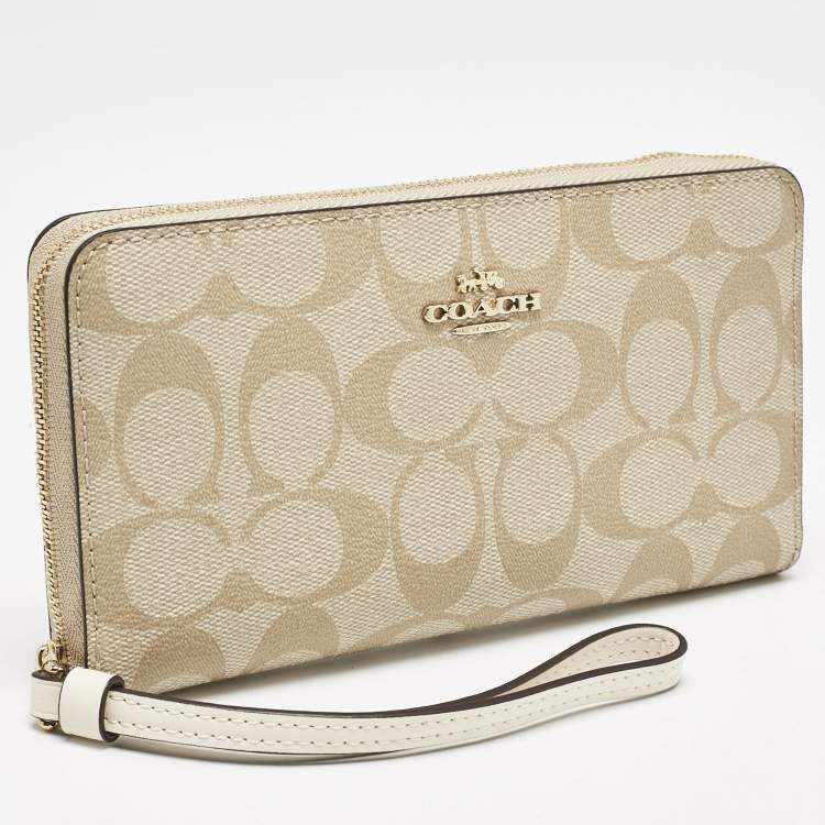 Pre Owned Coach Light Khaki Signature Coated Canvas Zip Around Wallet