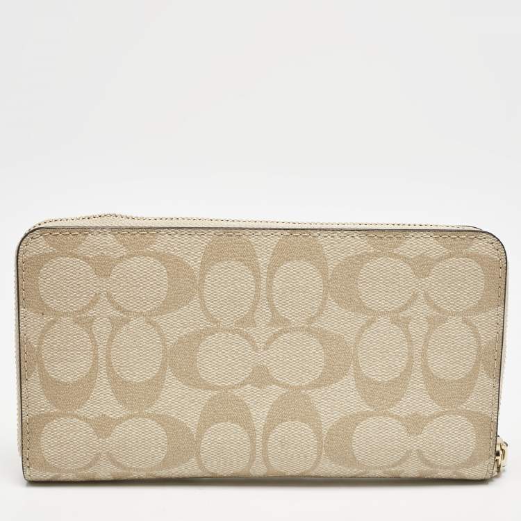 Pre Owned Coach Light Khaki Signature Coated Canvas Zip Around Wallet