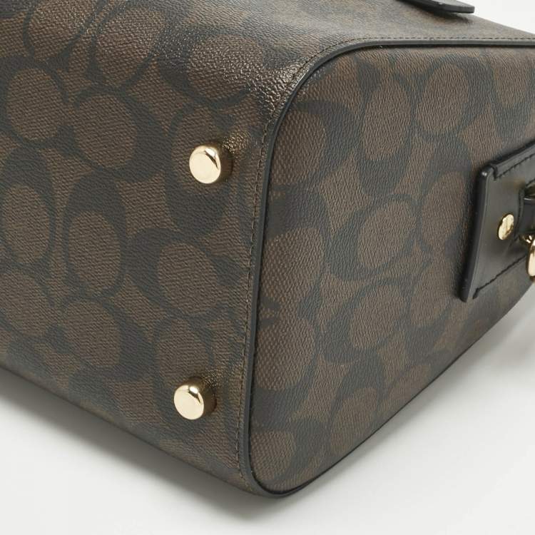 Pre Owned Coach Brown/Black Signature Coated Canvas and Leather Rowan Satchel