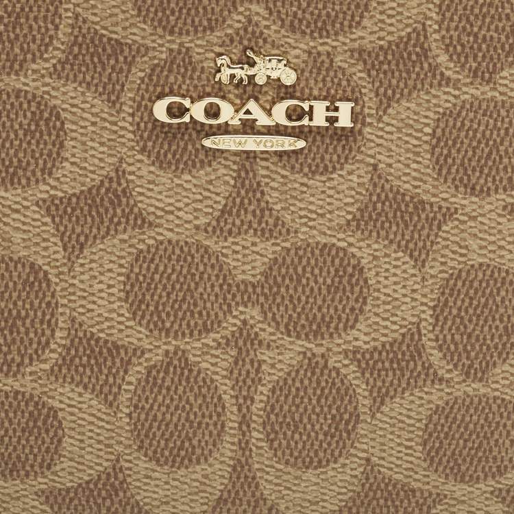 Pre Owned Coach Corner Zip Beige Signature Coated Canvas Wristlet Pouch