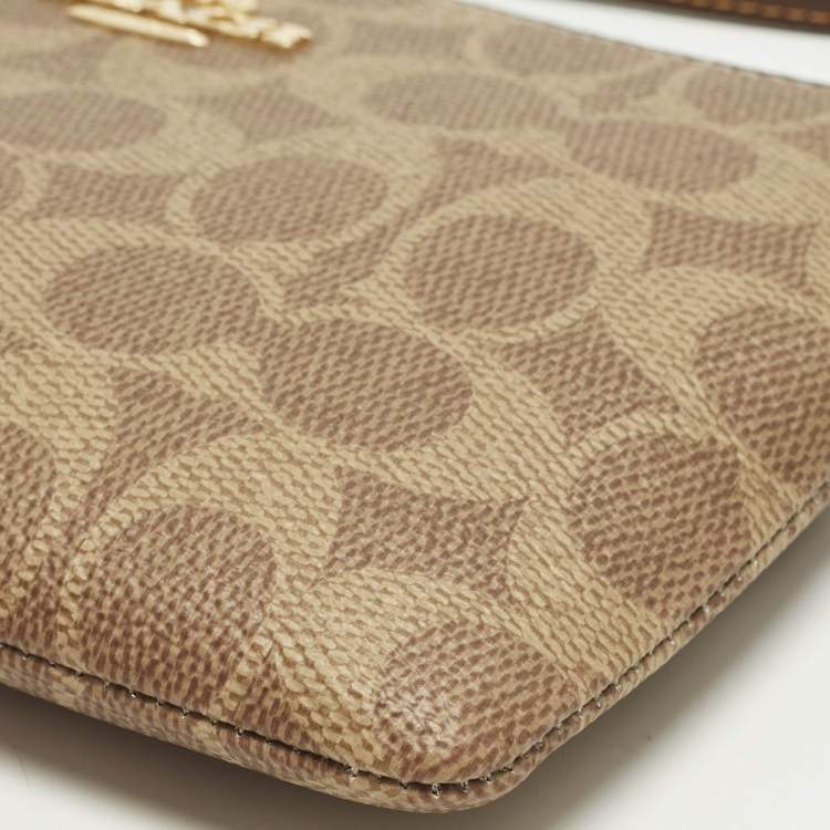 Pre Owned Coach Corner Zip Beige Signature Coated Canvas Wristlet Pouch
