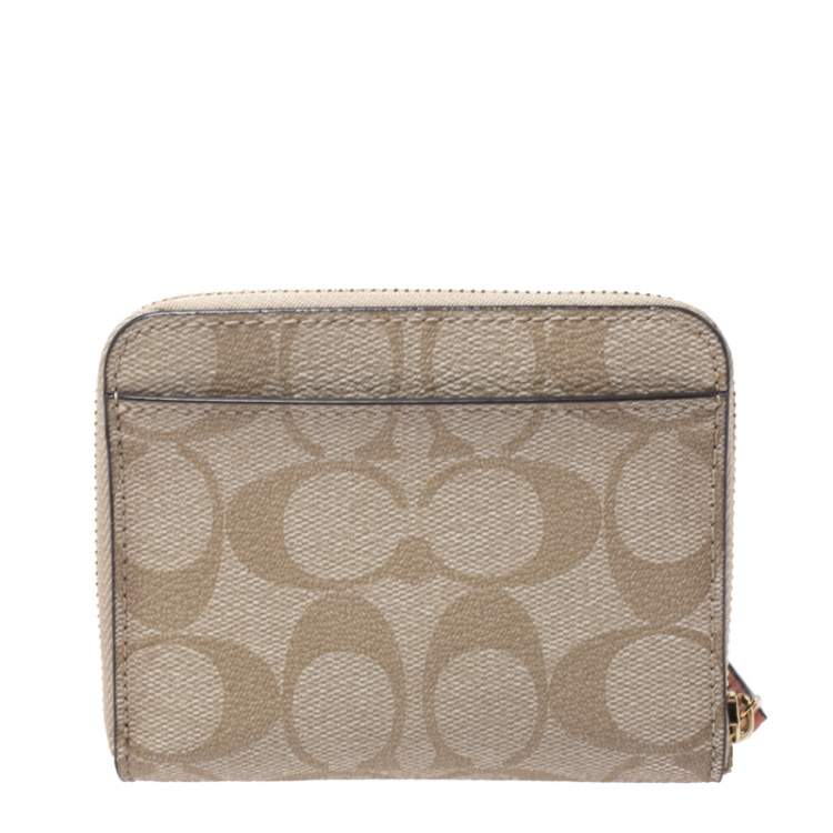 Pre Owned Coach Beige Signature Coated Canvas Strawberry Zip Around Wallet     