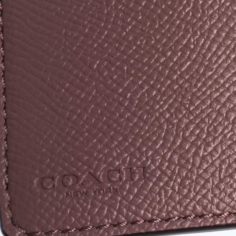 Pre Owned Coach Pink Textured Leather Compact Wallet