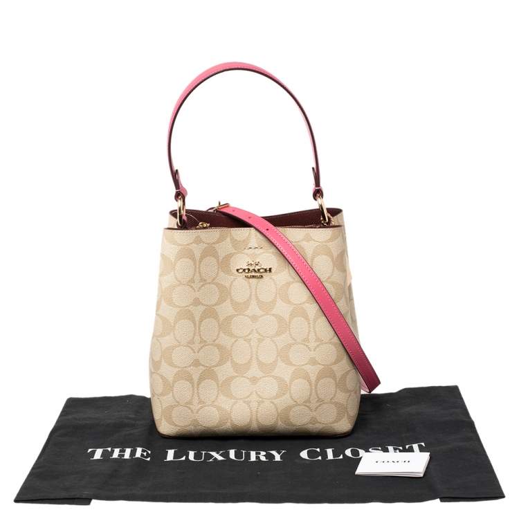 Pre Owned Coach Beige/Pink Signature Coated Canvas and Leather Small Town Bucket Bag