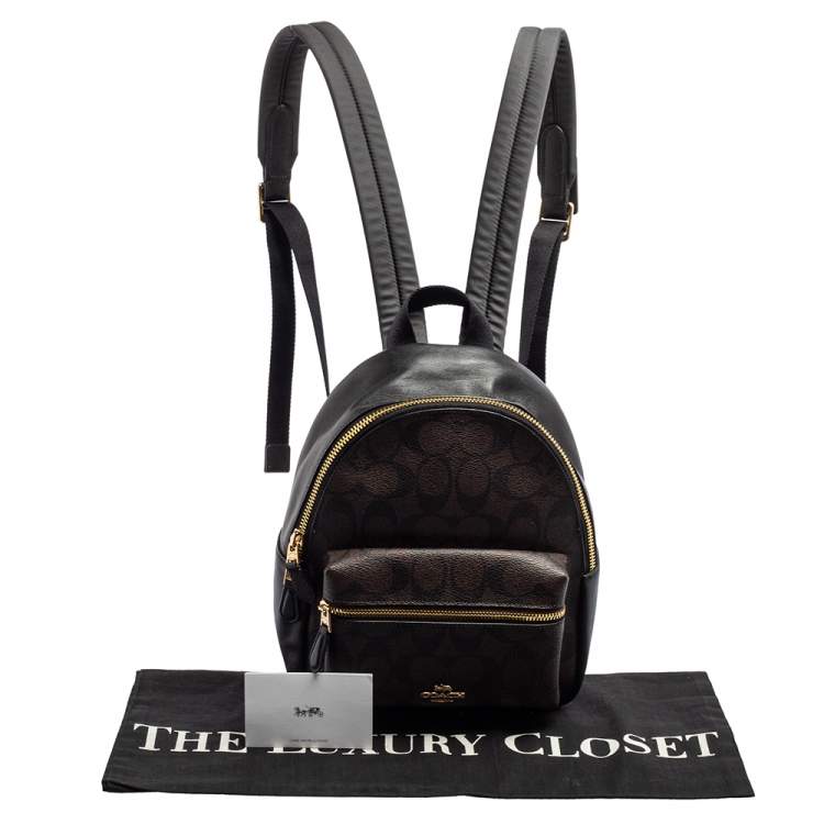 Pre Owned Coach Black/Brown Signature Coated Canvas and Leather Mini Charlie Backpack