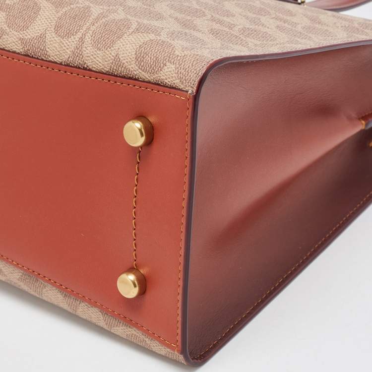 Pre Owned Coach Beige/Brown Signature Coated Canvas and Leather City Zip Tote