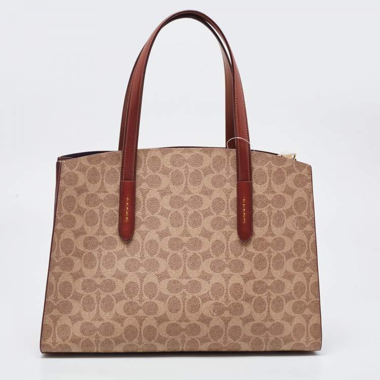 Pre Owned Coach Beige/Brown Signature Coated Canvas and Leather City Zip Tote