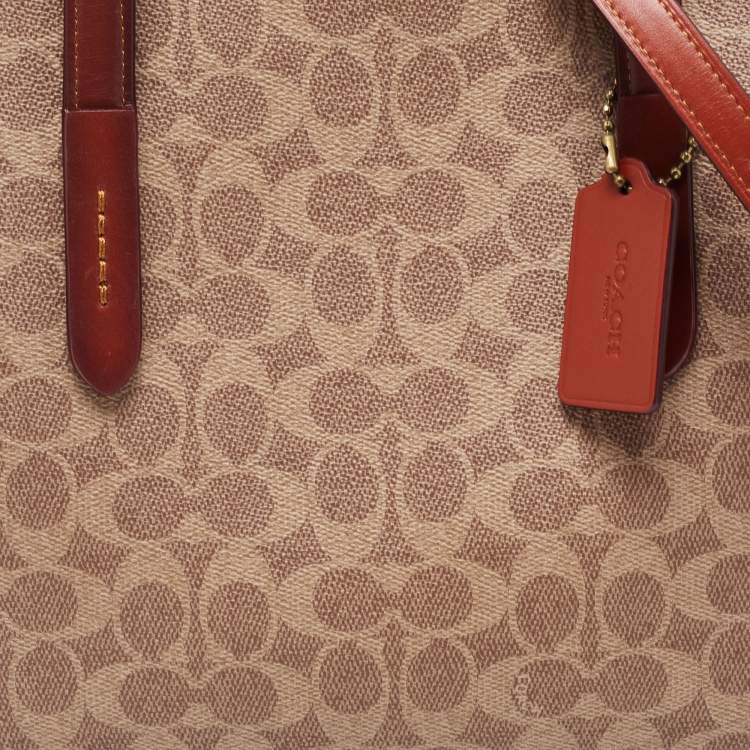 Pre Owned Coach Beige/Brown Signature Coated Canvas and Leather City Zip Tote